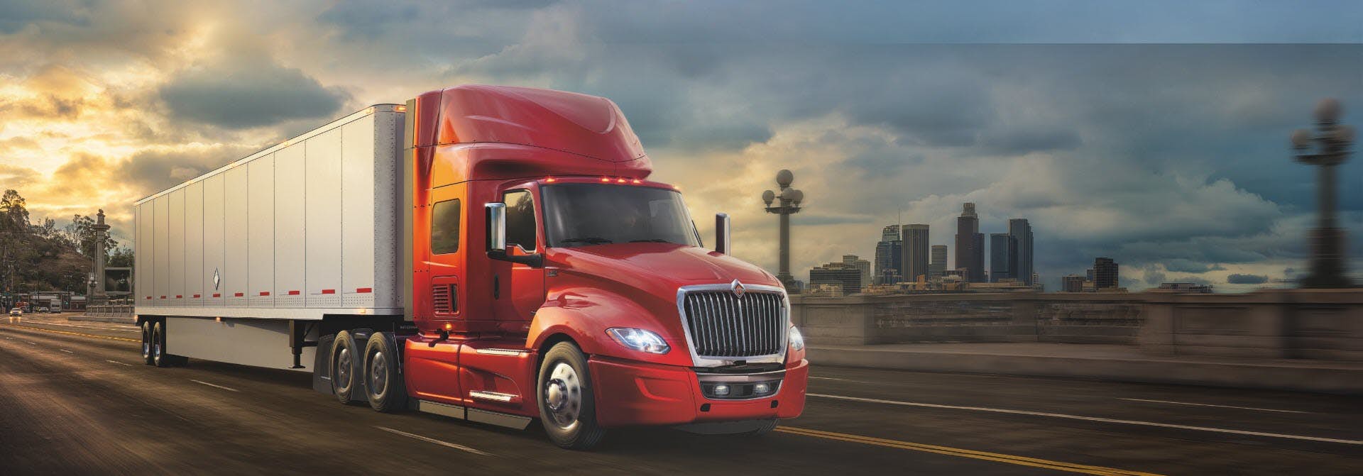 Red International Truck Driving Down Highway