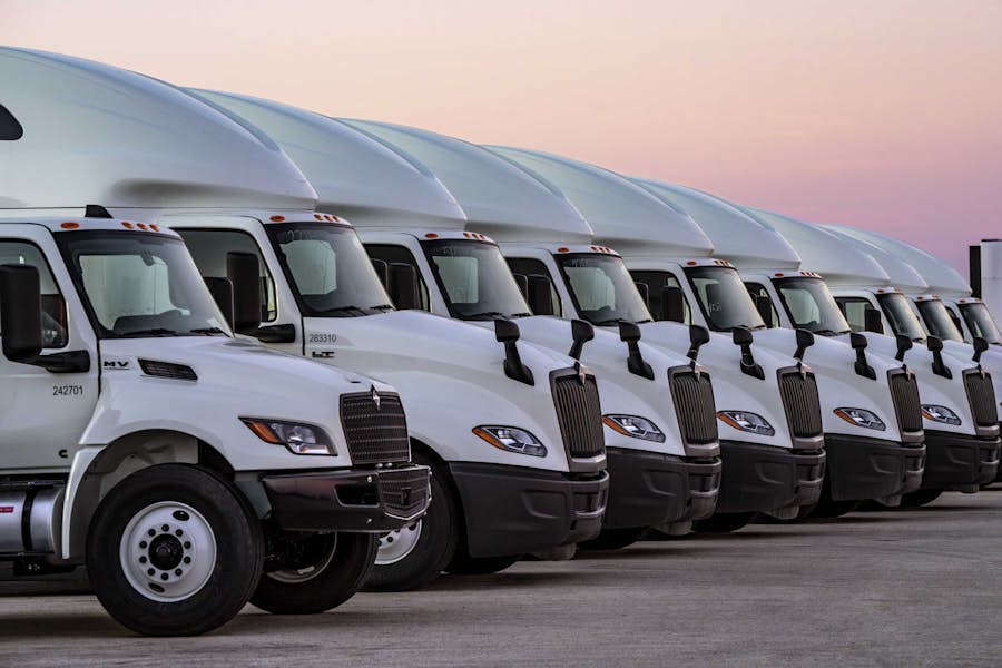 A row of white trucks