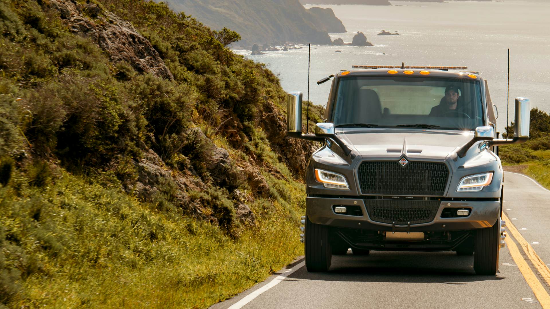 International truck driving on coastal highway