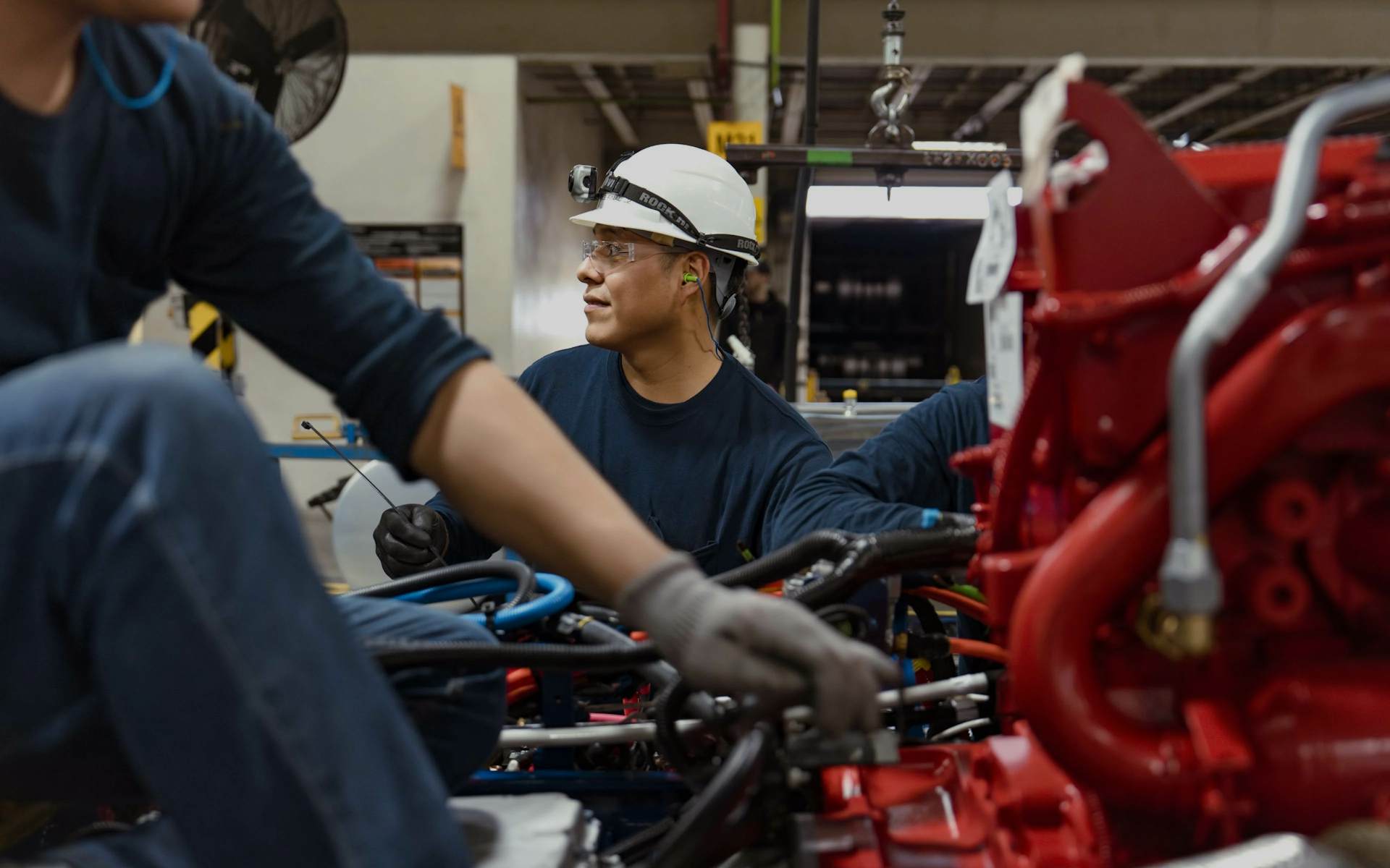 A group of people working on a machine